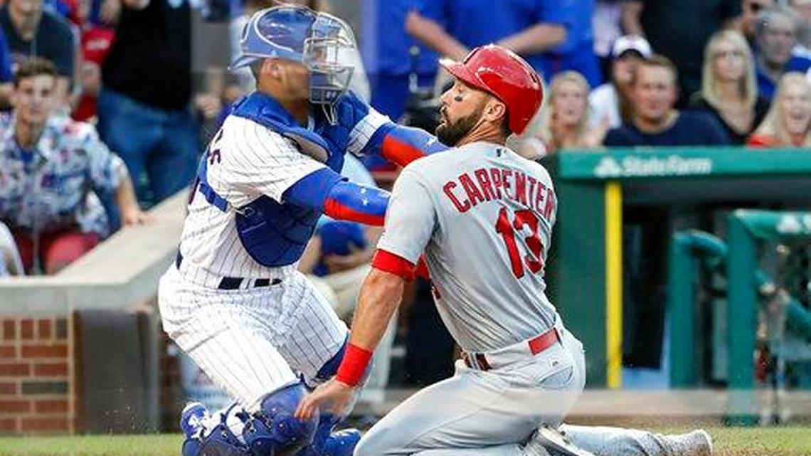 Then-St. Louis Cardinal Matt Carpenter is tagged out at home by Willson Contreras, who was with the Chicago Cubs at the time. The Cardinals are amid finalizing an agreement with Contreras, filling their most pressing offseason need.
