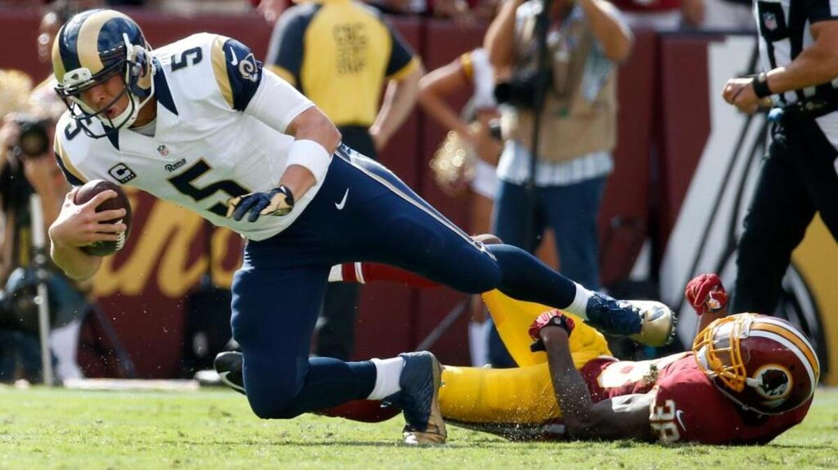 
Rams quarterback Nick Foles is sacked by Redskins Dashon Goldson during the second half Sunday in Landover, Md. The Redskins defeated the Rams 24-10.
