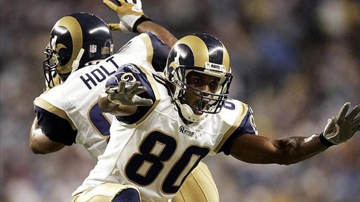 Isaac Bruce celebrates another St. Louis Rams touchdown with fellow wide receiver and Greatest Show on Turf teammate Torry Holt. In his latest column, Terry Mackin of the Belleville News-Democrat writes about the NFL and how he wishes St. Louis still had a team, among other football related topics.
