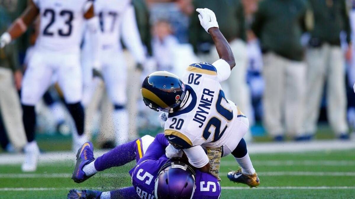 Minnesota Vikings quarterback Teddy Bridgewater (5) is brought down by St. Louis Rams cornerback Lamarcus Joyner (20) Sunday in Minneapolis. Bridgewater left the game with a concussion after this hit. (Jeff Haynes/AP Images for Panini)