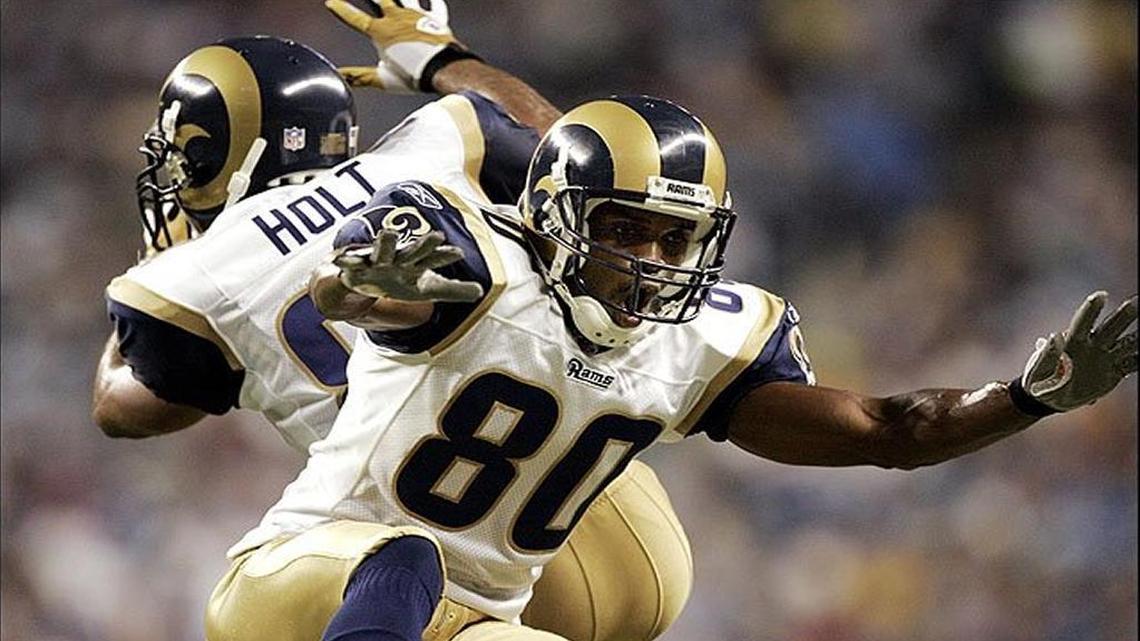 Former Rams’ wide receivers Isaac Bruce and Torry Holt celebrate a touchdown during the Greatest Show on Turf days in St. Louis.