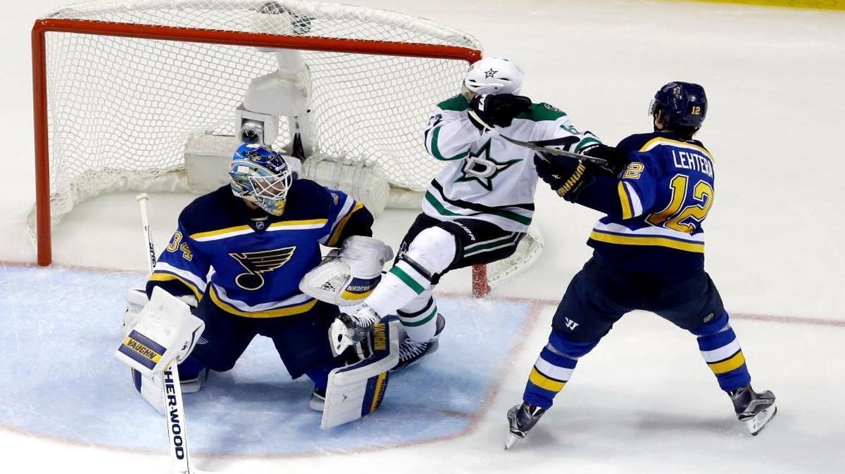 Dallas Stars' Ales Hemsky, is caught between St. Louis Blues goalie Jake Allen, left, and Jori Lehtera, right, during the second period of Game 6 in St. Louis. (AP Photo/Jeff Roberson)