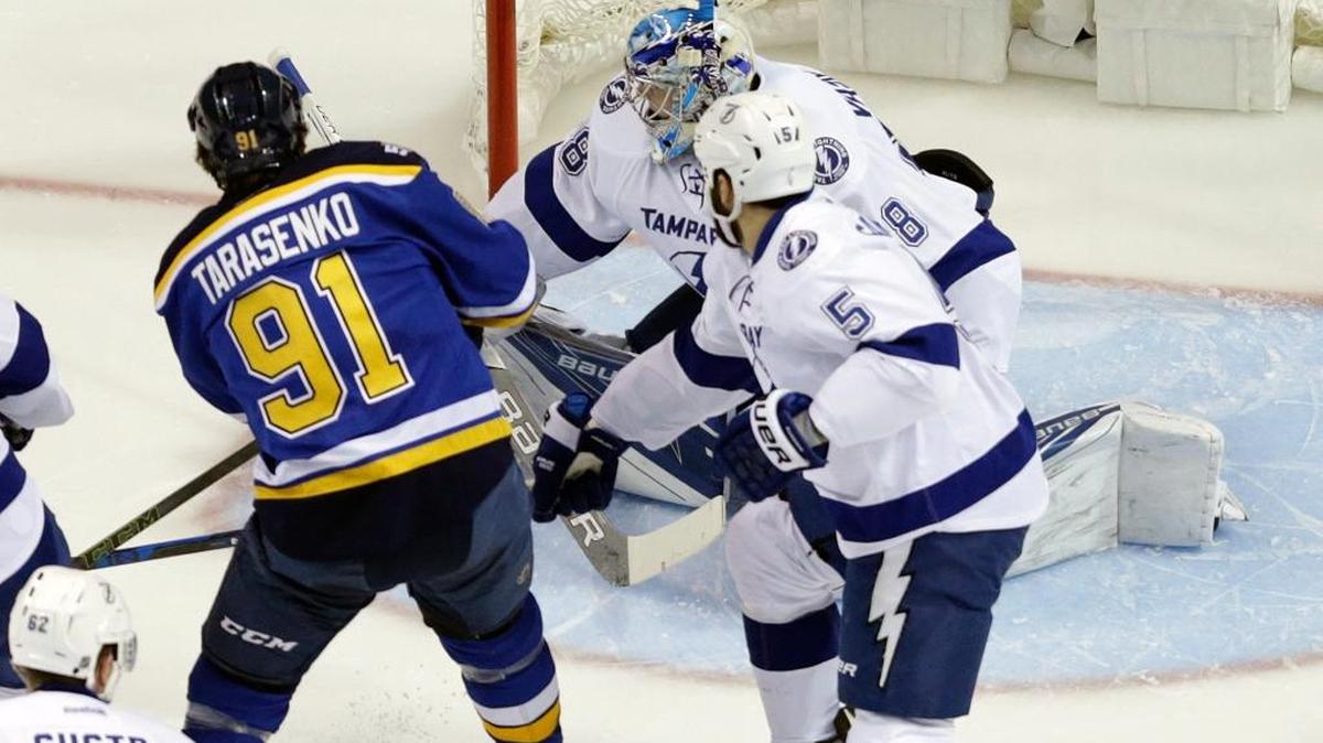 St. Louis Blues' Vladimir Tarasenko (91), of Russia, scores past Tampa Bay Lightning goalie Andrei Vasilevskiy, of Russia, and Lightning's Jason Garrison (5) during the first period. (AP Photo/Jeff Roberson)