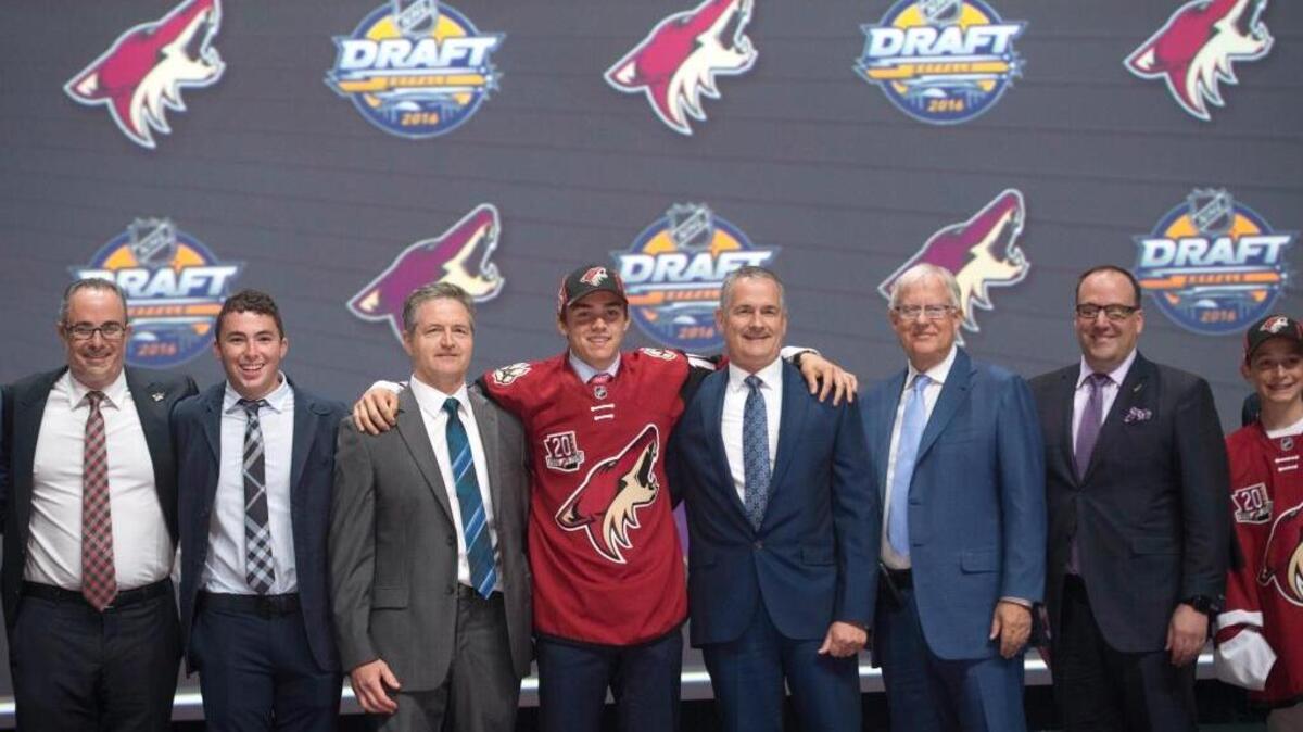 Clayton Keller, seventh overall pick, stands at center stage with members of the Arizona Coyotes management team at the NHL Draft on Friday in Buffalo, N.Y.