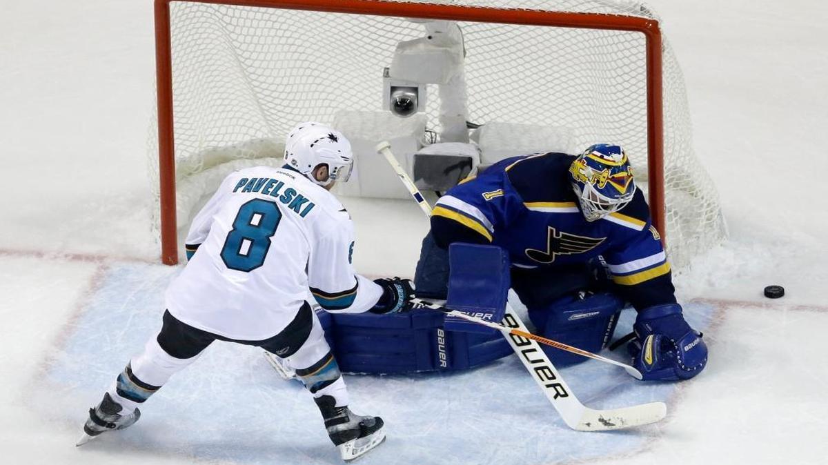 St. Louis Blues goalie Brian Elliott (1) blocks a shot by San Jose Sharks center Joe Pavelski (8) during the second period in Game 1 of the Western Conference Final on Sunday.