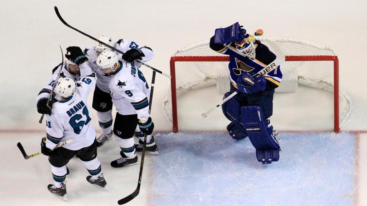 San Jose Sharks center Tommy Wingels celebrates with his teammates after scoring a goal against Blues goalie Brian Elliott during the first period in Game 2.