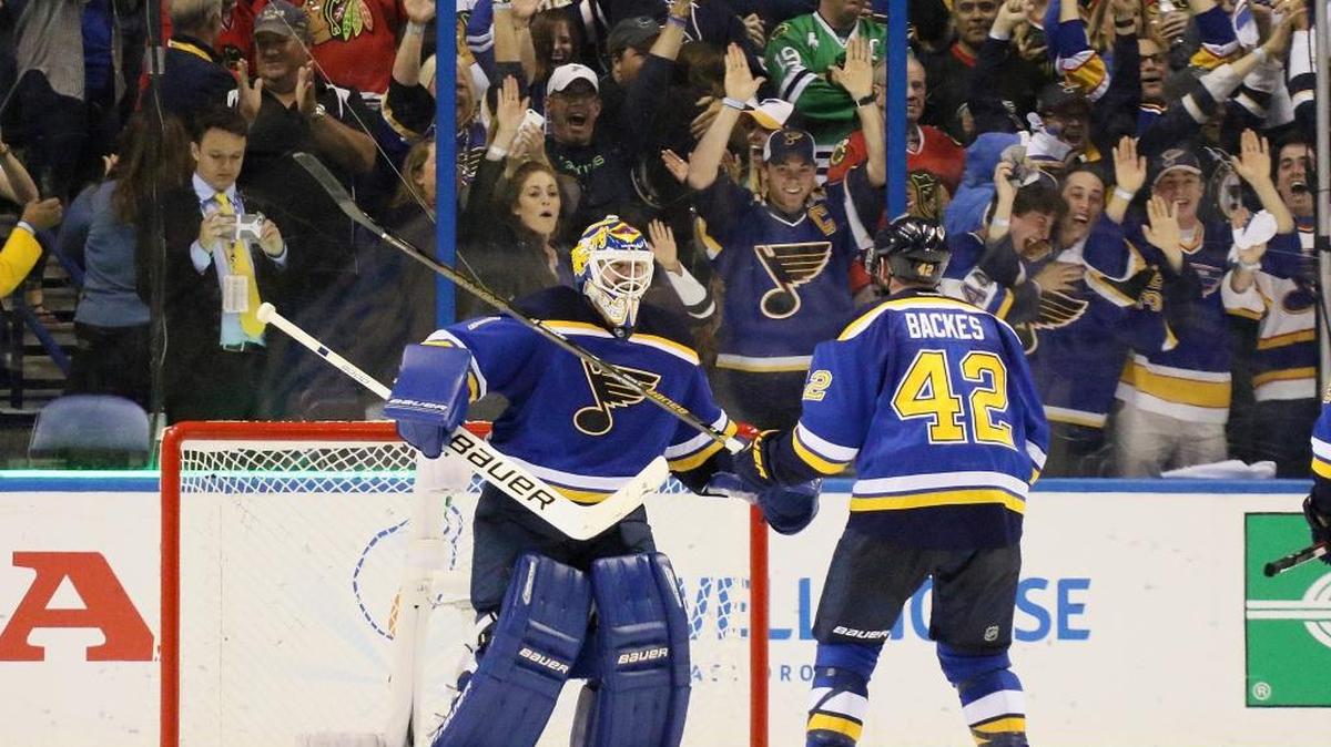 St. Louis Blues goaltender Brian Elliott, left, celebrates with center David Backes defeating the Chicago Blackhawks at the end of Game 7 of an NHL hockey first-round Stanley Cup playoff series in St. Louis on Monday.