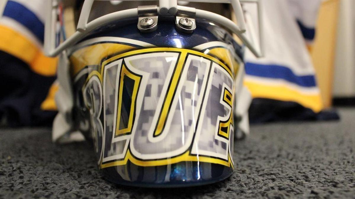 St. Louis Blues goalie Jake Allen’s special Veterans Day mask includes the team’s wordmark in camouflage across the chin and throat.