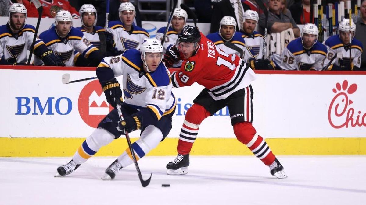 The St. Louis Blues and Chicago Blackhawks will battle in the NHL Bridgestone Winter Classic outdoor hockey game Jan. 2, 1017 at Busch Stadium in St. Louis. Here, Jori Lehtera (12) and the Blackhawks’ Jonathan Toews (19) battle for the puck.