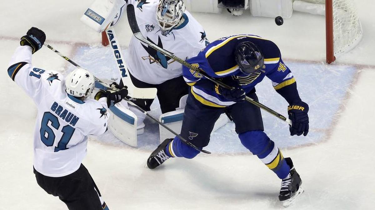 St. Louis Blues center David Backes, right, scores a goal Sunday against San Jose Sharks goalie Martin Jones (31) during the first period in Game 1 of the Western Conference finals.