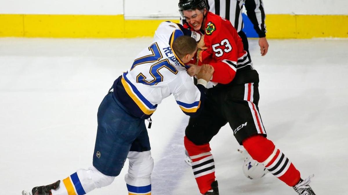 Expect another first-round battle between the St. Louis Blues and Chicago Blackhawks similar to this recent bout between Blues winger Ryan Reaves (75) and Chicago’s Brandon Mashinter (53). (AP Photo/Kamil Krzaczynski)