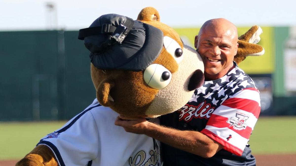 Kurt Angle, a wrestling gold medal winner from the 1996 Atlanta Olympics and a professional wrestling legend, was the guest of the Gateway Grizzlies on Friday. He threw out a first pitch and then gave Izzy The Grizzlie a playful headlock.