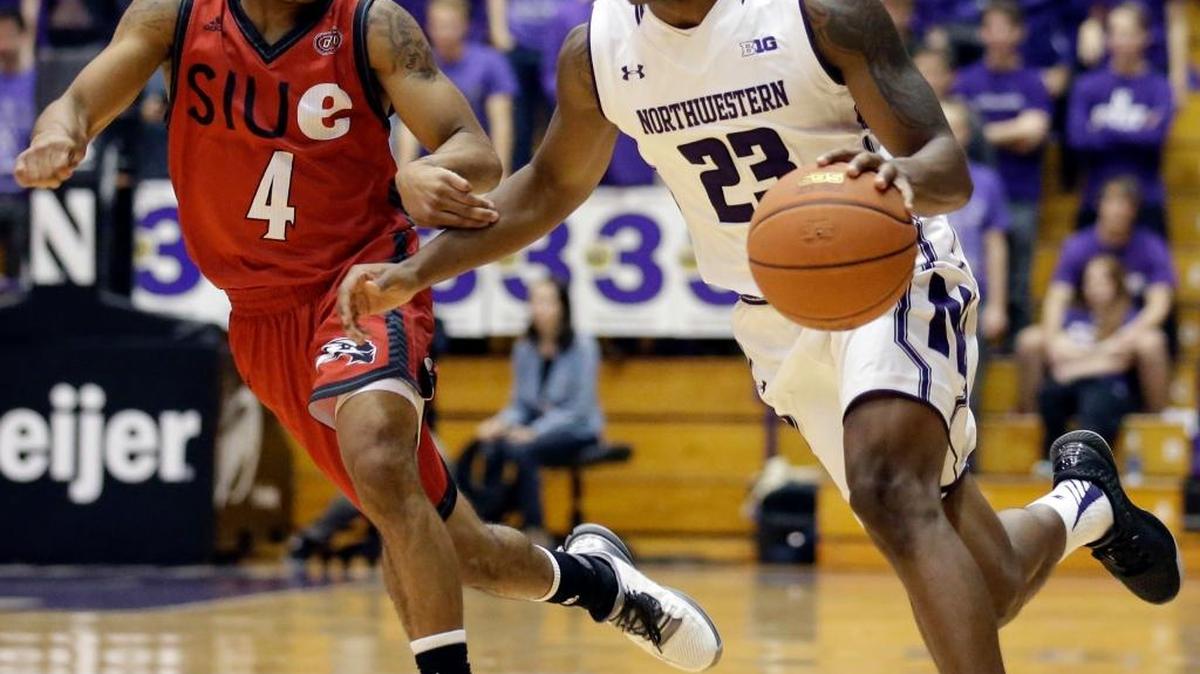 Northwestern guard Jordan Ash, right, drives as SIU-Edwardsville guard C.J. Carr guards during the second half of an NCAA college basketball game on Saturday, Dec. 5, 2015, in Evanston, Ill.