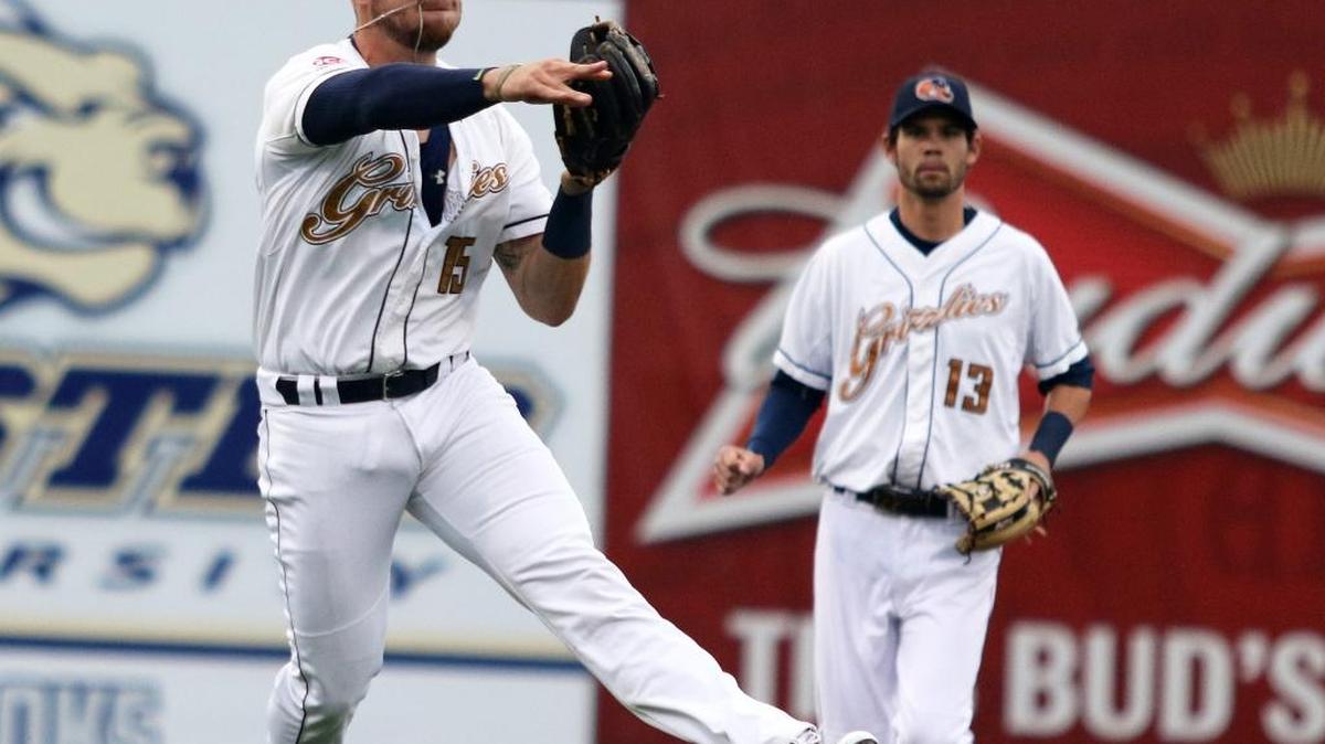 Gateway third baseman Craig Massoni comes across the infield to make throw to retire a runner Thursday at GCS Ballpark. The Grizzlies defeated Normal 1-0 to sweep the Cornbelters. See a gallery of photographs from the game at bnd.com.