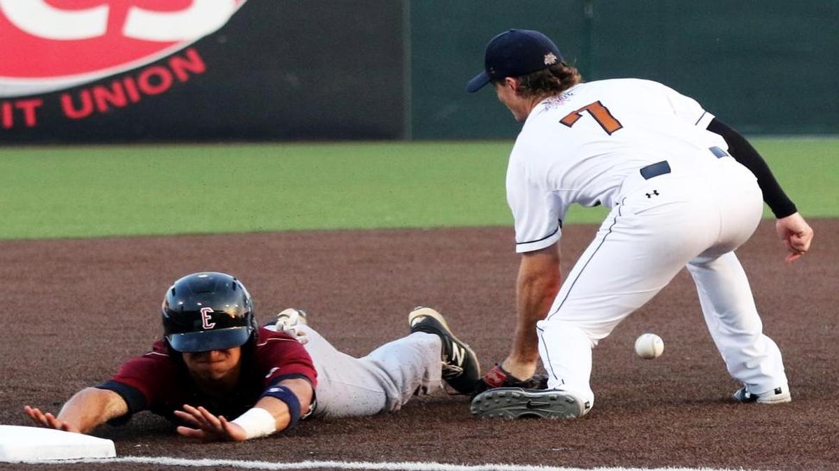 The Evansville Otters’ Kolten Yamuguchi slides safely into third base as the Gateway Grizzlies’ Seth Heck awaits the throw during Wednesday’s game at GCS Ballpark. Gateway scored an 8-3 victory in the Frontier League matchup.