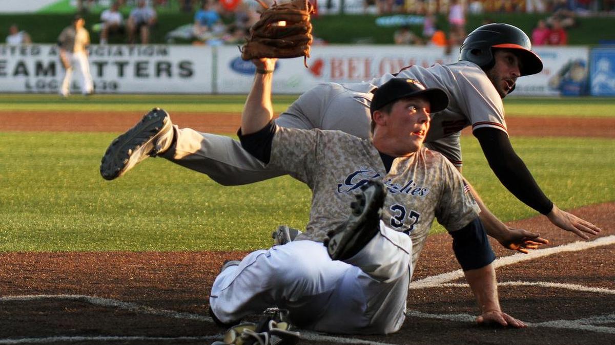 
Gateway pitcher Jordan Spencer holds up the ball after taking a throw from the catcher when Schaumberg’s Kyle Ruchim tried to score on a wild pitch during Sunday’s game at GCS Ballpark in Sauget. The Boomers defeated the Grizzlies 5-2.
