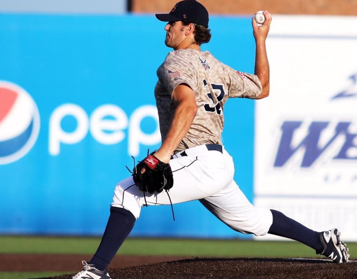Will Anderson of the Grizzlies pitches in the first inning of a three game series to the Traverse City Beach Bums .